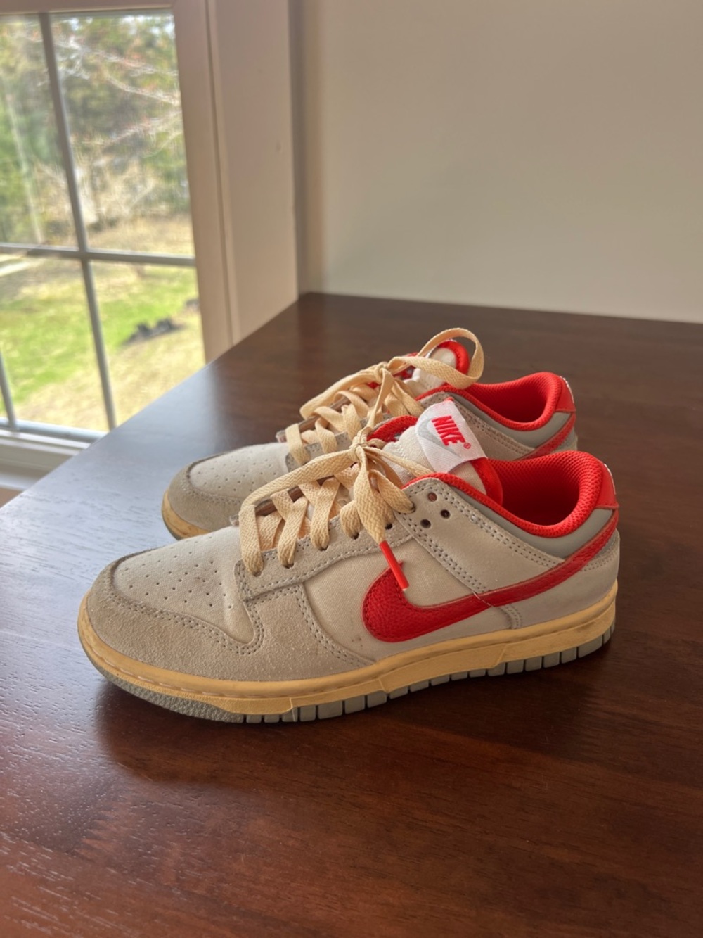 Nike Dunks in butter yellow and red
